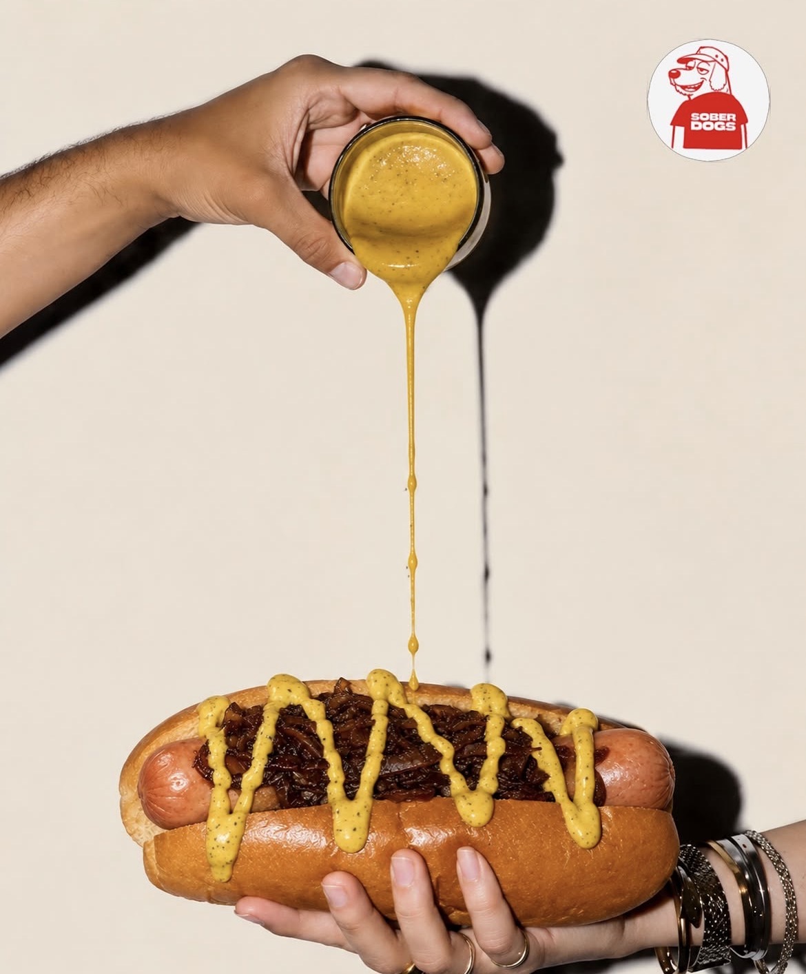 Sober Dogs signature hot dog with mustard drizzle